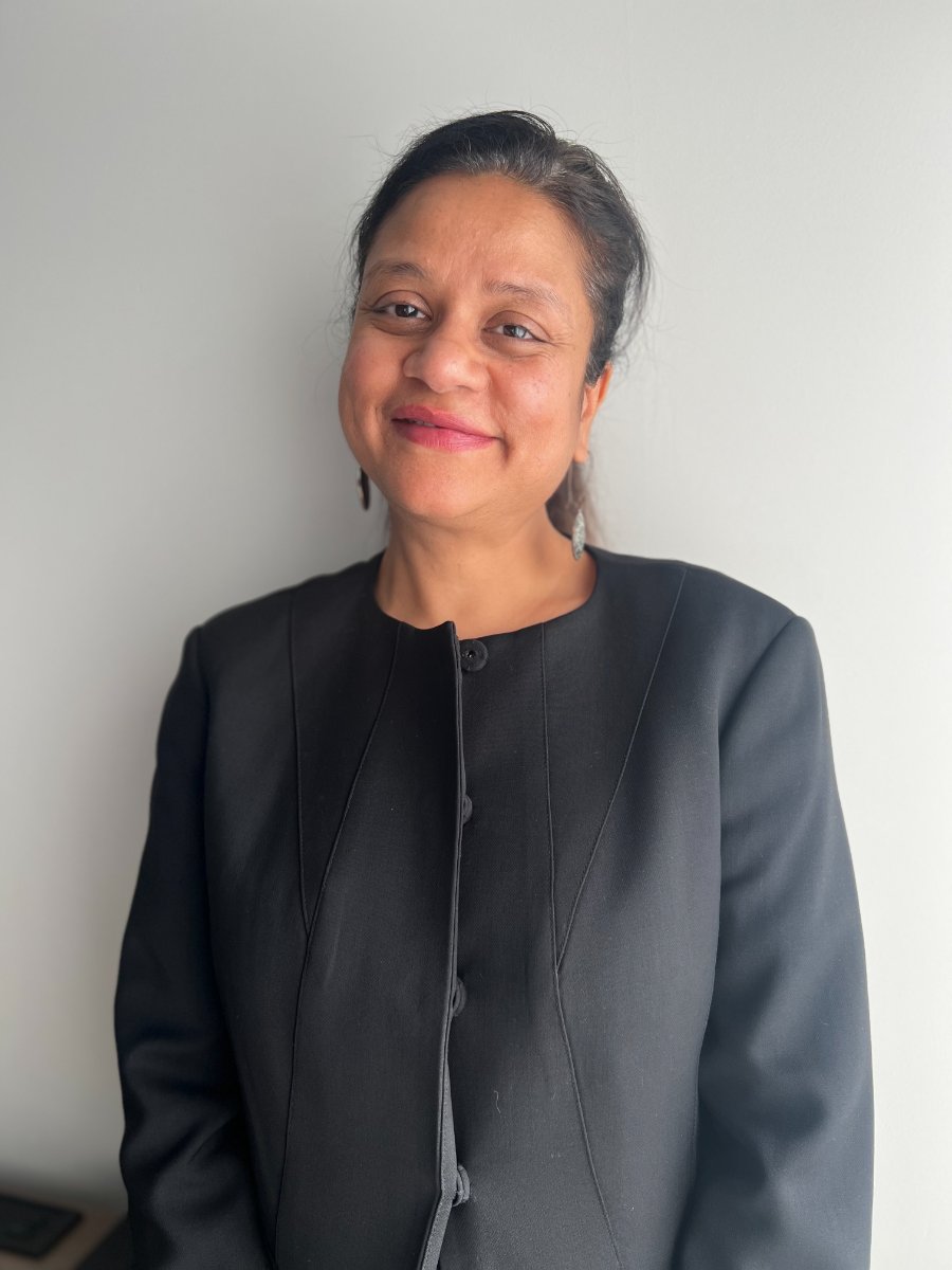 A professional headshot of Pragya Saiwal, Finance Educator & CEO of IC Wealth in Fairview, NC